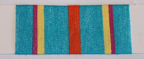 Image of a card warp with blue, magenta, yellow, and orange stripes