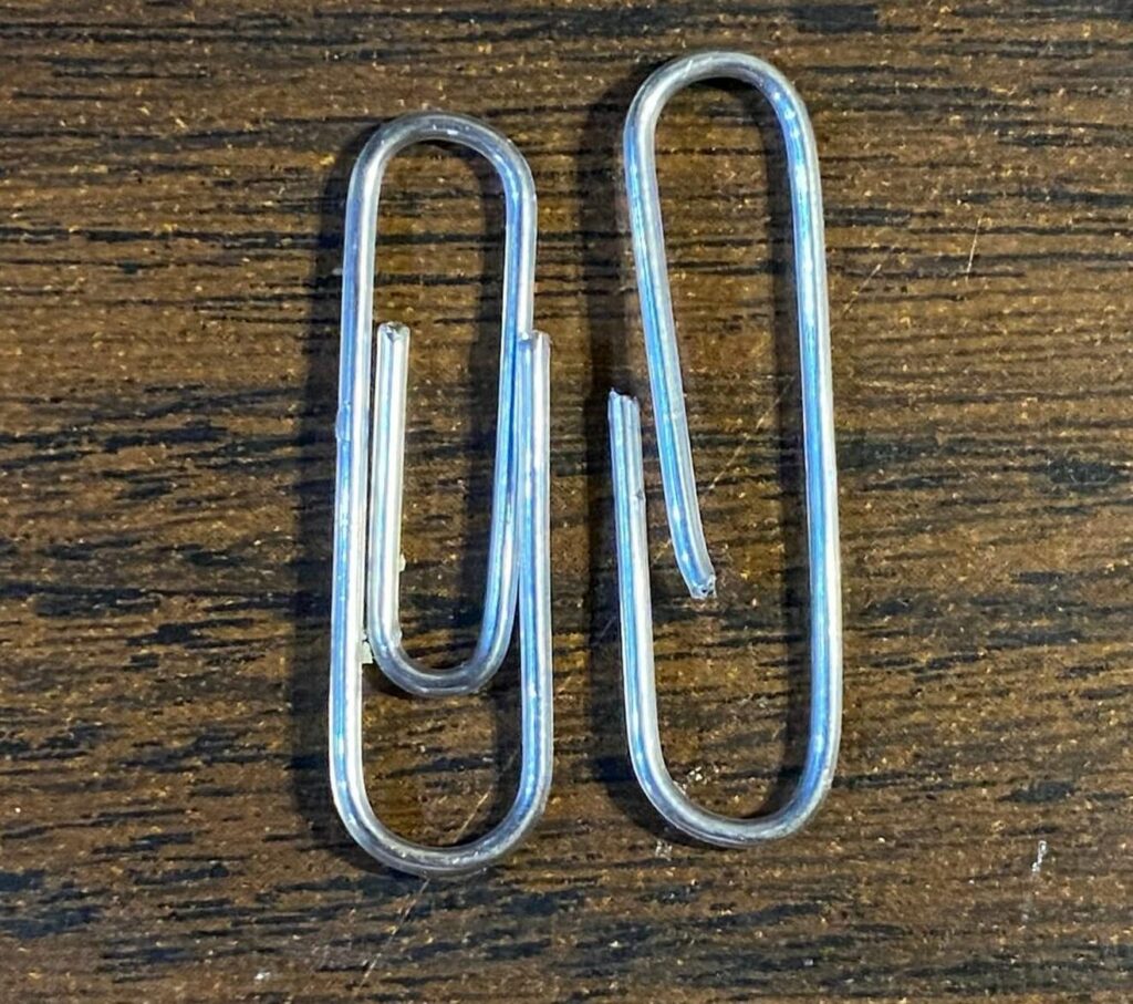 The finished paperclip prepared to put on the heddle on the weaving loom