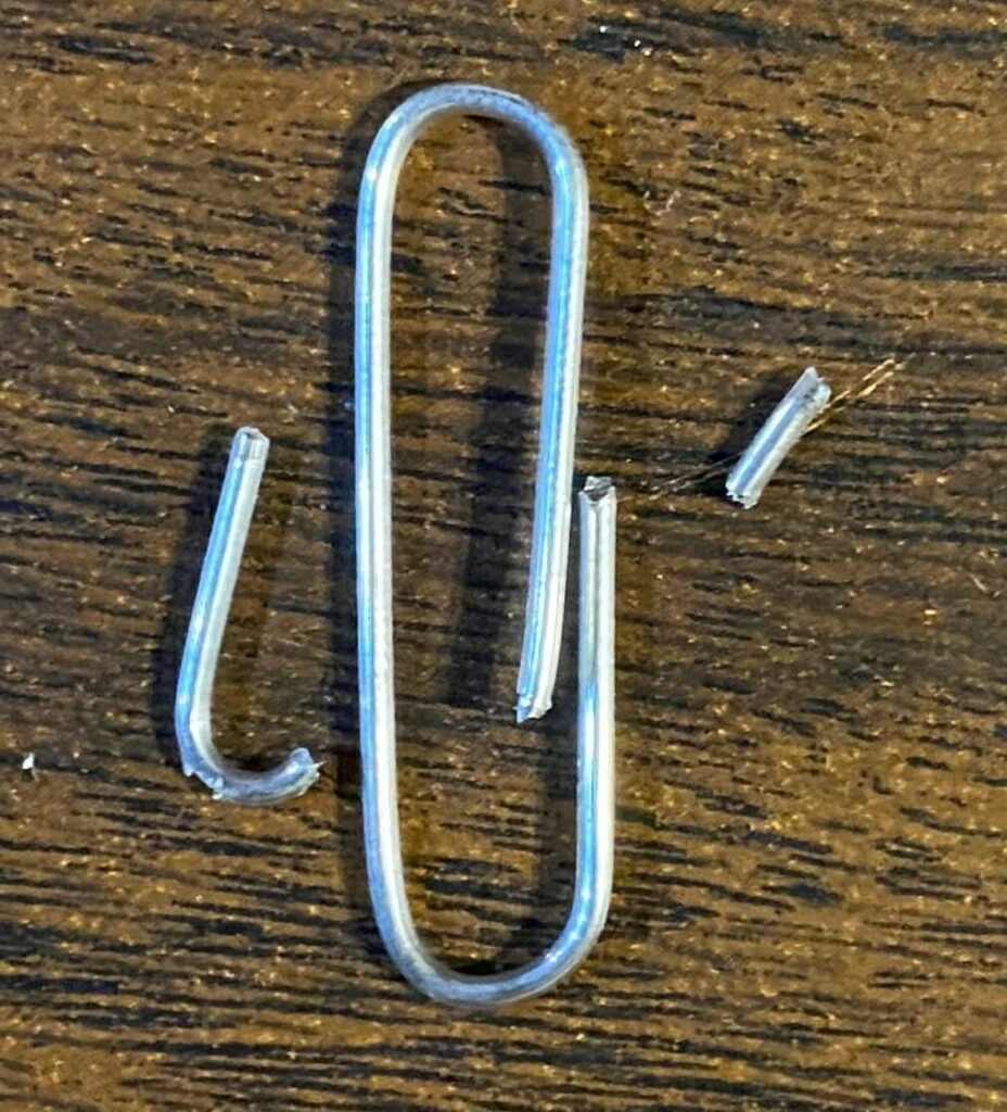 Cutting a paperclip for using on a shaft on a weaving loom