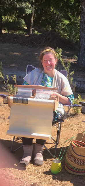 Carly weaving at her loom