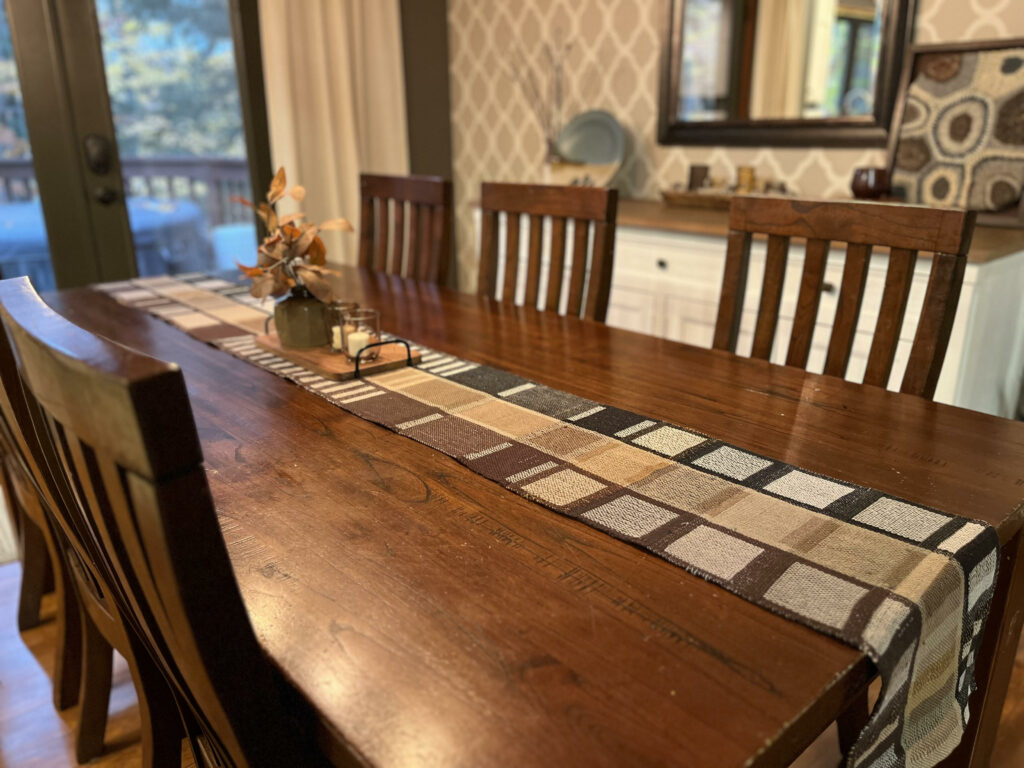 Dining room table with Joy Hoggs handwoven Runner Handwoven Gifts